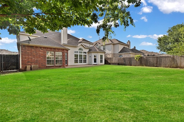 8620 Thistle Ridge Ter, Fort Worth, TX 76123 - rear view of house featuring brick siding, a patio area, a shingled roof, and a chimney
