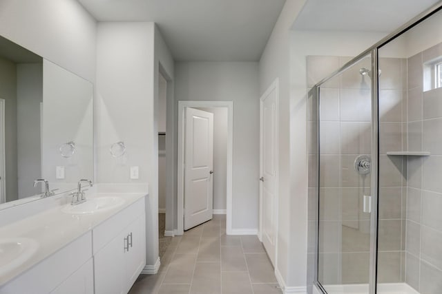 514 Stagg St, Mckinney, TX 75069 - full bathroom with double vanity, a stall shower, tile patterned floors, and baseboards