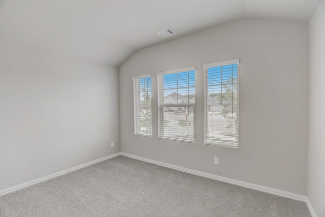 514 Stagg St, Mckinney, TX 75069 - carpeted empty room with vaulted ceiling and baseboards