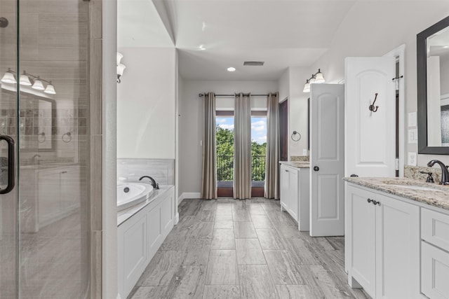 1424 Keeneland Hill Dr, Aledo, TX 76008 - full bath featuring two vanities, a stall shower, a bath, and baseboards