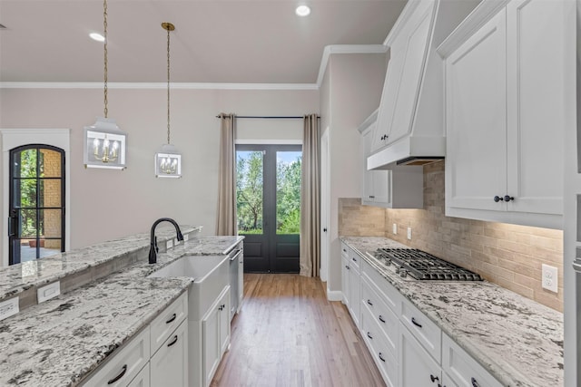 1424 Keeneland Hill Dr, Aledo, TX 76008 - kitchen with premium range hood, appliances with stainless steel finishes, decorative backsplash, light wood finished floors, and white cabinetry