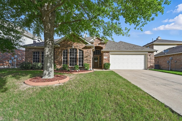 2110 Pecan Ridge Dr, Forney, TX 75126 - traditional home with a garage, concrete driveway, a front yard, and brick siding