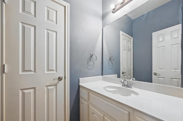 2110 Pecan Ridge Dr, Forney, TX 75126 - bathroom featuring vanity and a textured wall
