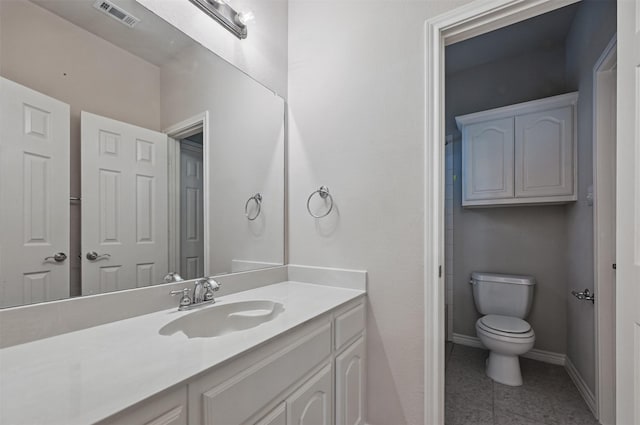 2110 Pecan Ridge Dr, Forney, TX 75126 - bathroom with vanity, baseboards, toilet, and tile patterned floors