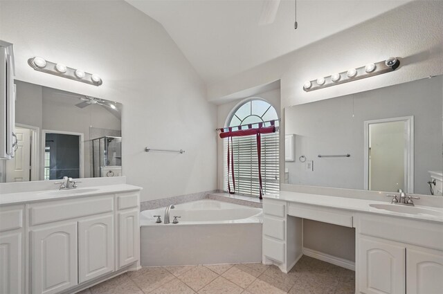2110 Pecan Ridge Dr, Forney, TX 75126 - full bathroom featuring ceiling fan, a shower stall, a bath, two vanities, and high vaulted ceiling