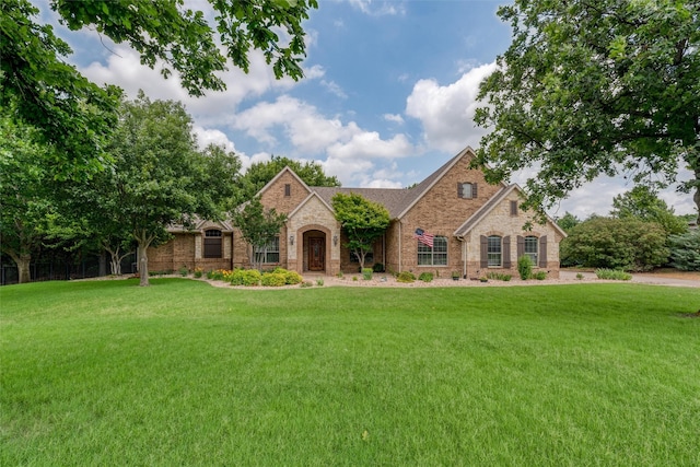 136 Whispering Winds Dr, Gunter, TX 75058 - view of front of house featuring stone siding, a front yard, and brick siding