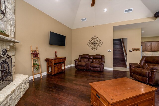 136 Whispering Winds Dr, Gunter, TX 75058 - living room featuring dark wood-style flooring, stairway, a fireplace, ceiling fan, and high vaulted ceiling