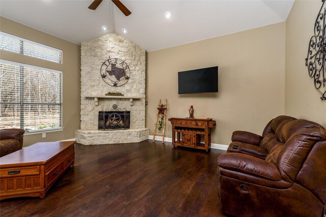 136 Whispering Winds Dr, Gunter, TX 75058 - living room featuring a ceiling fan, lofted ceiling, wood finished floors, a stone fireplace, and baseboards