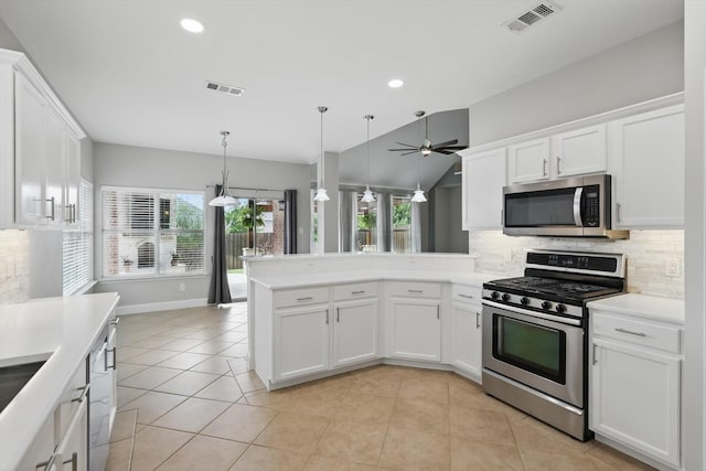 6808 Edgefield Dr, Denton, TX 76210 - kitchen featuring appliances with stainless steel finishes, decorative backsplash, ceiling fan, healthy amount of natural light, and recessed lighting