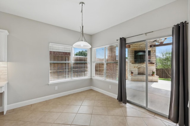 6808 Edgefield Dr, Denton, TX 76210 - unfurnished dining area with baseboards and light tile patterned floors
