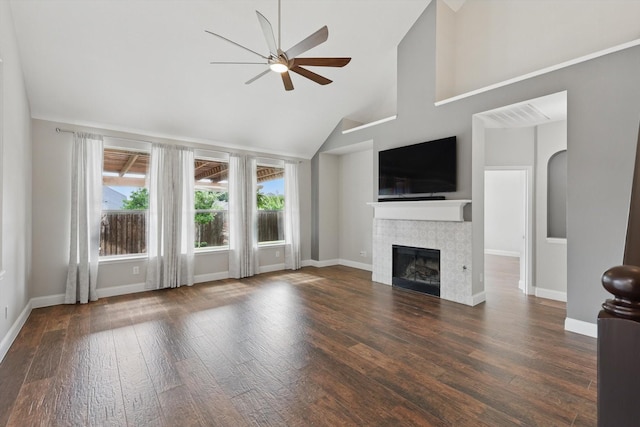 6808 Edgefield Dr, Denton, TX 76210 - unfurnished living room featuring ceiling fan, high vaulted ceiling, baseboards, a fireplace, and wood finished floors