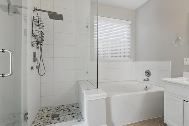 6808 Edgefield Dr, Denton, TX 76210 - bathroom with vanity, a stall shower, a garden tub, and tile patterned flooring