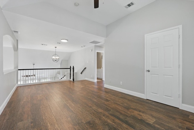 6808 Edgefield Dr, Denton, TX 76210 - empty room with ceiling fan, dark wood-type flooring, a chandelier, baseboards, and vaulted ceiling