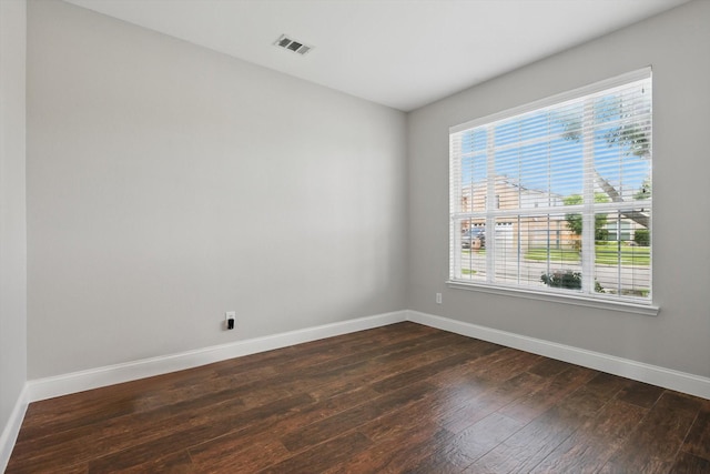 6808 Edgefield Dr, Denton, TX 76210 - unfurnished room with dark wood-style floors, healthy amount of natural light, and baseboards