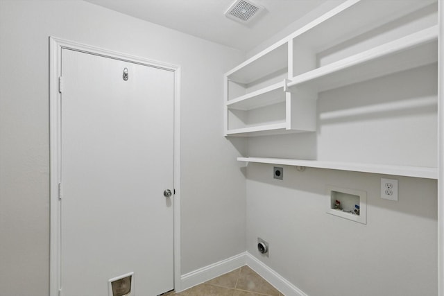 6808 Edgefield Dr, Denton, TX 76210 - washroom featuring hookup for an electric dryer, hookup for a washing machine, baseboards, and tile patterned flooring