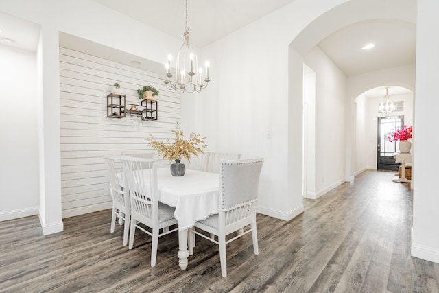 1406 Darlington Ln, Forney, TX 75126 - dining room featuring a chandelier, arched walkways, wood finished floors, and baseboards