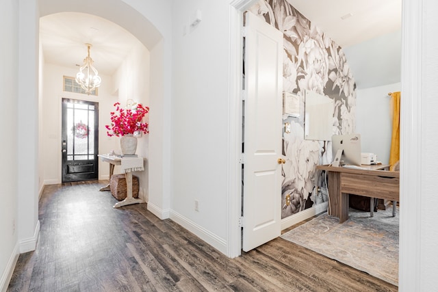 1406 Darlington Ln, Forney, TX 75126 - entrance foyer featuring wood finished floors, arched walkways, a chandelier, and baseboards