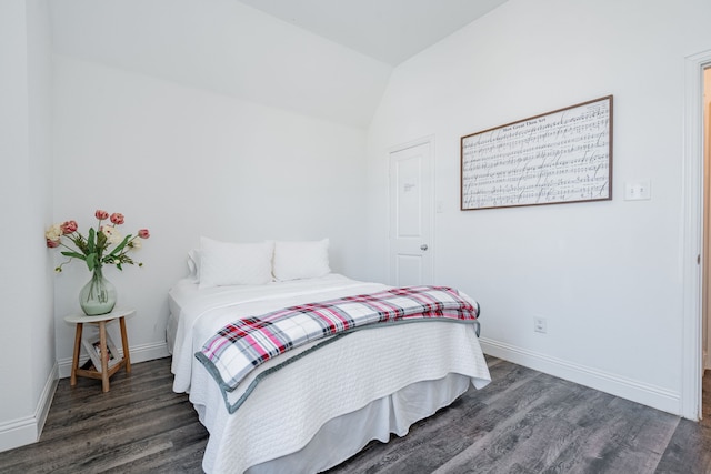 1406 Darlington Ln, Forney, TX 75126 - bedroom with dark wood-style floors, lofted ceiling, and baseboards