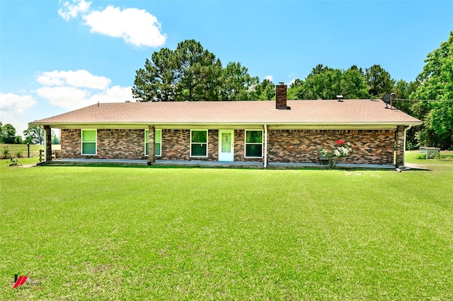 255 Barry Rd, Logansport, LA 71049 - view of front of property featuring a chimney, a front lawn, and brick siding