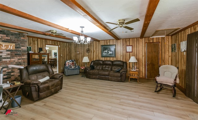 255 Barry Rd, Logansport, LA 71049 - living room with ceiling fan, beamed ceiling, light wood finished floors, wooden walls, and a chandelier
