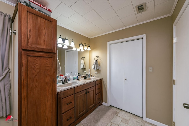 255 Barry Rd, Logansport, LA 71049 - full bathroom featuring double vanity, ornamental molding, baseboards, and stone finish floors
