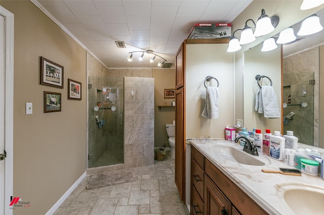 255 Barry Rd, Logansport, LA 71049 - bathroom with double vanity, toilet, a stall shower, crown molding, and baseboards