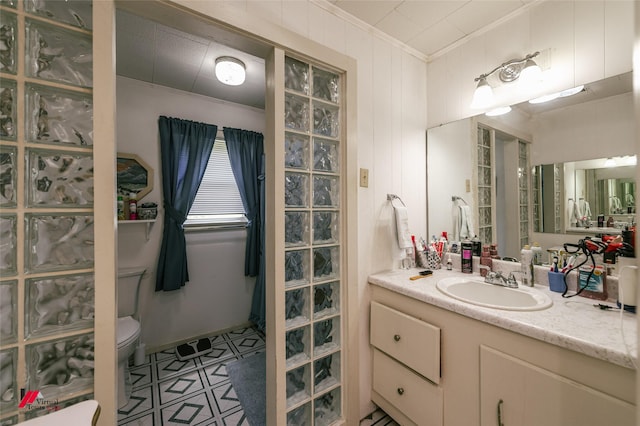 255 Barry Rd, Logansport, LA 71049 - bathroom with ornamental molding, toilet, vanity, and tile patterned flooring