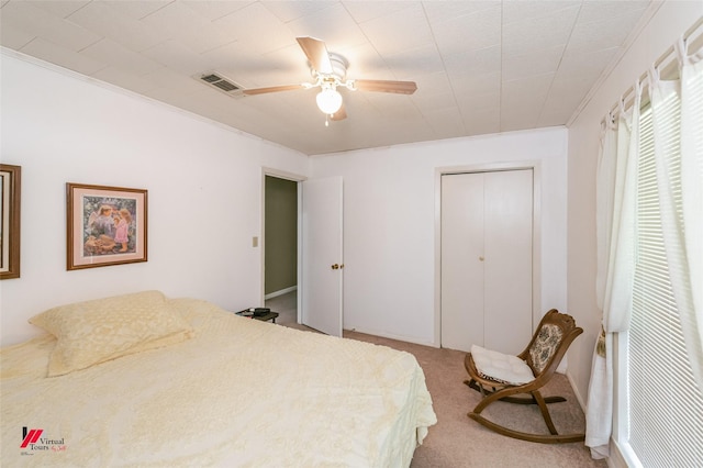255 Barry Rd, Logansport, LA 71049 - bedroom with carpet floors, a ceiling fan, crown molding, and a closet