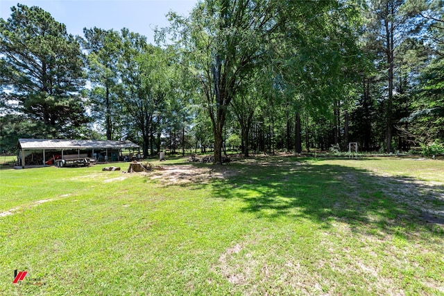 255 Barry Rd, Logansport, LA 71049 - view of green lawn featuring a carport