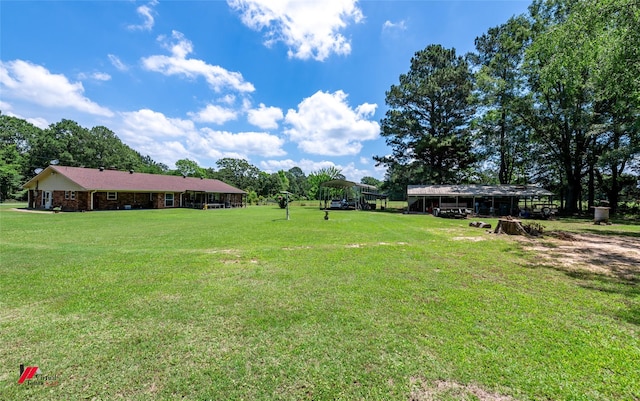 255 Barry Rd, Logansport, LA 71049 - view of green lawn with a carport