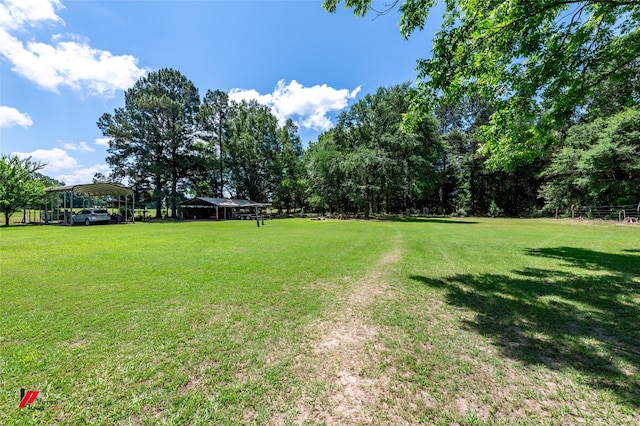 255 Barry Rd, Logansport, LA 71049 - view of green lawn featuring a carport