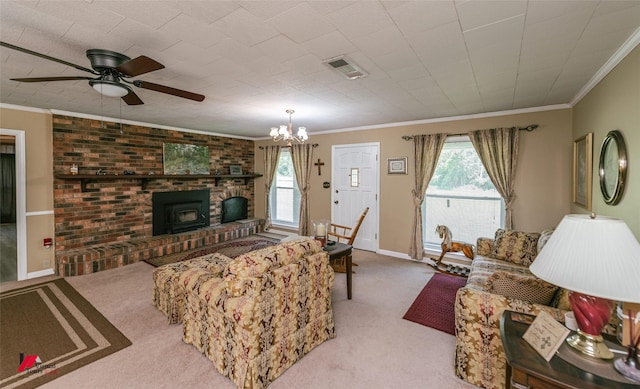 255 Barry Rd, Logansport, LA 71049 - carpeted living room with a wood stove, a ceiling fan, plenty of natural light, crown molding, and a chandelier