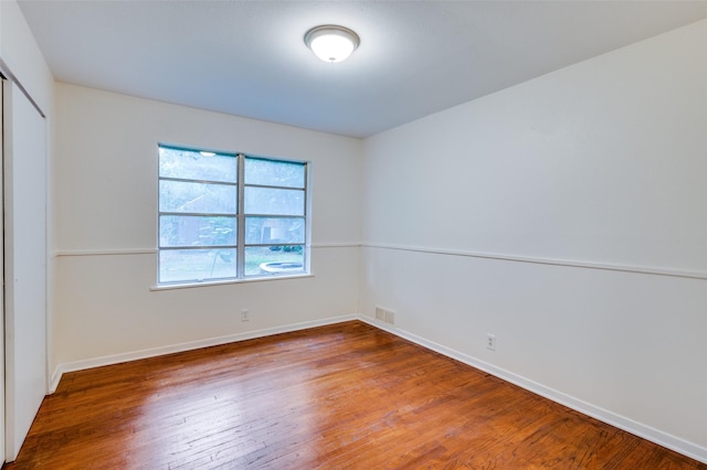 7612 Oxley Dr, Richland Hills, TX 76118 - unfurnished bedroom with wood finished floors, baseboards, and a closet