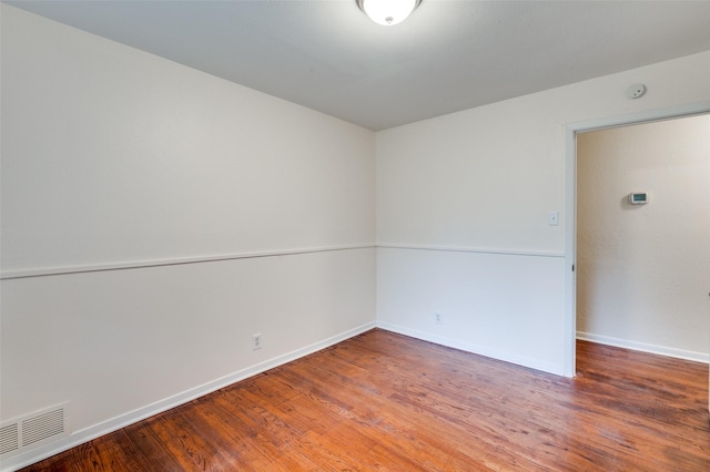 7612 Oxley Dr, Richland Hills, TX 76118 - spare room featuring wood finished floors and baseboards