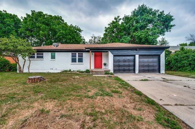 7612 Oxley Dr, Richland Hills, TX 76118 - view of front of house with driveway, an attached garage, brick siding, and a front yard