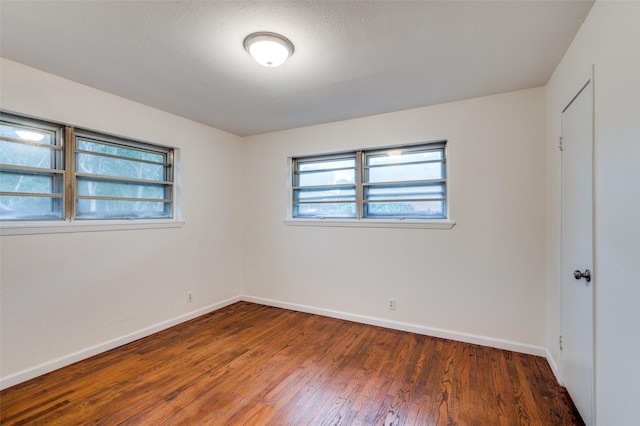 7612 Oxley Dr, Richland Hills, TX 76118 - unfurnished room featuring baseboards and wood finished floors