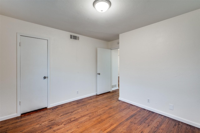 7612 Oxley Dr, Richland Hills, TX 76118 - spare room with wood finished floors and baseboards