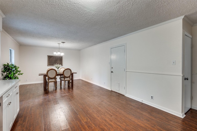 7612 Oxley Dr, Richland Hills, TX 76118 - dining room with crown molding, a textured ceiling, dark wood-style floors, a chandelier, and baseboards