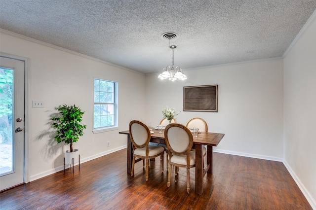 7612 Oxley Dr, Richland Hills, TX 76118 - dining room with dark wood-style flooring, a textured ceiling, a chandelier, crown molding, and baseboards