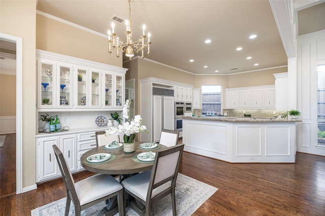5115 Oak Tree Cir, Dallas, TX 75287 - dining room featuring a chandelier, ornamental molding, dark wood finished floors, and recessed lighting