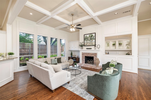 5115 Oak Tree Cir, Dallas, TX 75287 - living room with a decorative wall, coffered ceiling, ceiling fan, a brick fireplace, and dark wood-style flooring