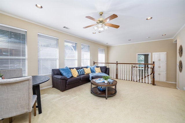 5115 Oak Tree Cir, Dallas, TX 75287 - living room featuring light carpet, crown molding, plenty of natural light, a ceiling fan, and recessed lighting