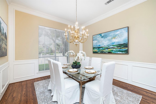 5115 Oak Tree Cir, Dallas, TX 75287 - dining space featuring a chandelier, crown molding, wood finished floors, a wainscoted wall, and a decorative wall