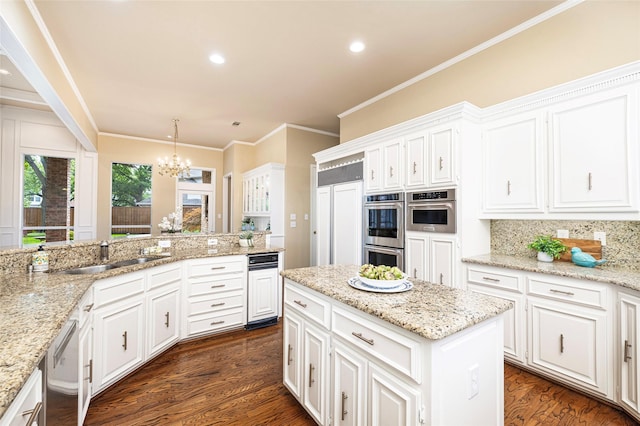 5115 Oak Tree Cir, Dallas, TX 75287 - kitchen featuring a sink, appliances with stainless steel finishes, dark wood finished floors, white cabinetry, and recessed lighting