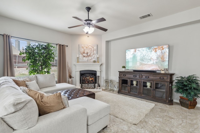 10420 Old Eagle River Ln, Mckinney, TX 75072 - living area with a ceiling fan and a lit fireplace