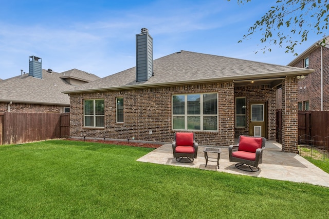 10420 Old Eagle River Ln, Mckinney, TX 75072 - back of property with brick siding, a patio area, a shingled roof, and a chimney