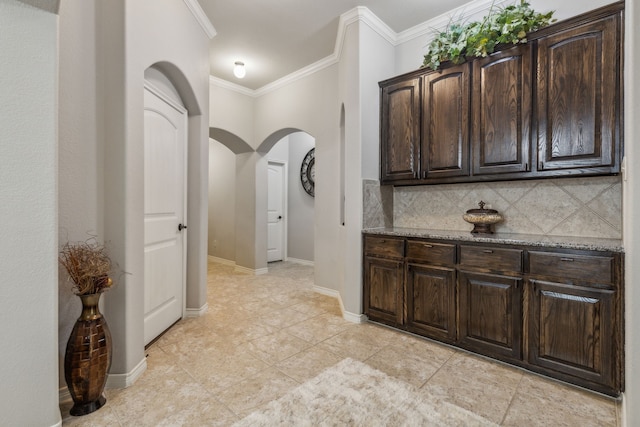 10420 Old Eagle River Ln, Mckinney, TX 75072 - hall featuring arched walkways, crown molding, light tile patterned flooring, and baseboards
