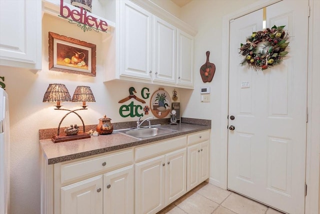 5133 Sealands Ln, Fort Worth, TX 76116 - kitchen with a sink, light tile patterned floors, white cabinets, and dark countertops