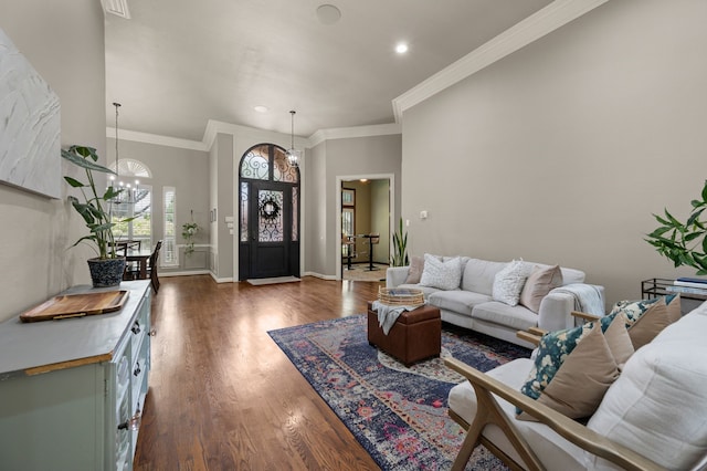 840 Falcon Ln, Coppell, TX 75019 - living room with dark wood-style flooring, ornamental molding, recessed lighting, baseboards, and a chandelier
