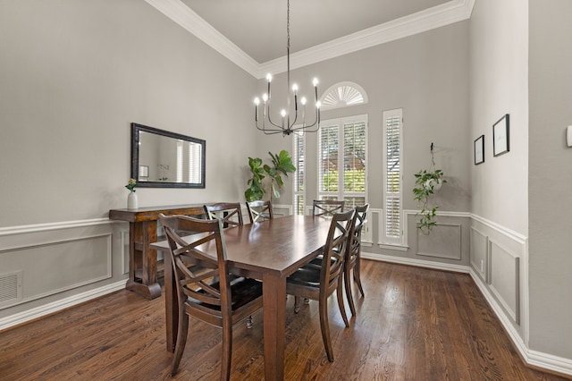840 Falcon Ln, Coppell, TX 75019 - dining room featuring ornamental molding, dark wood-style flooring, a decorative wall, wainscoting, and a chandelier
